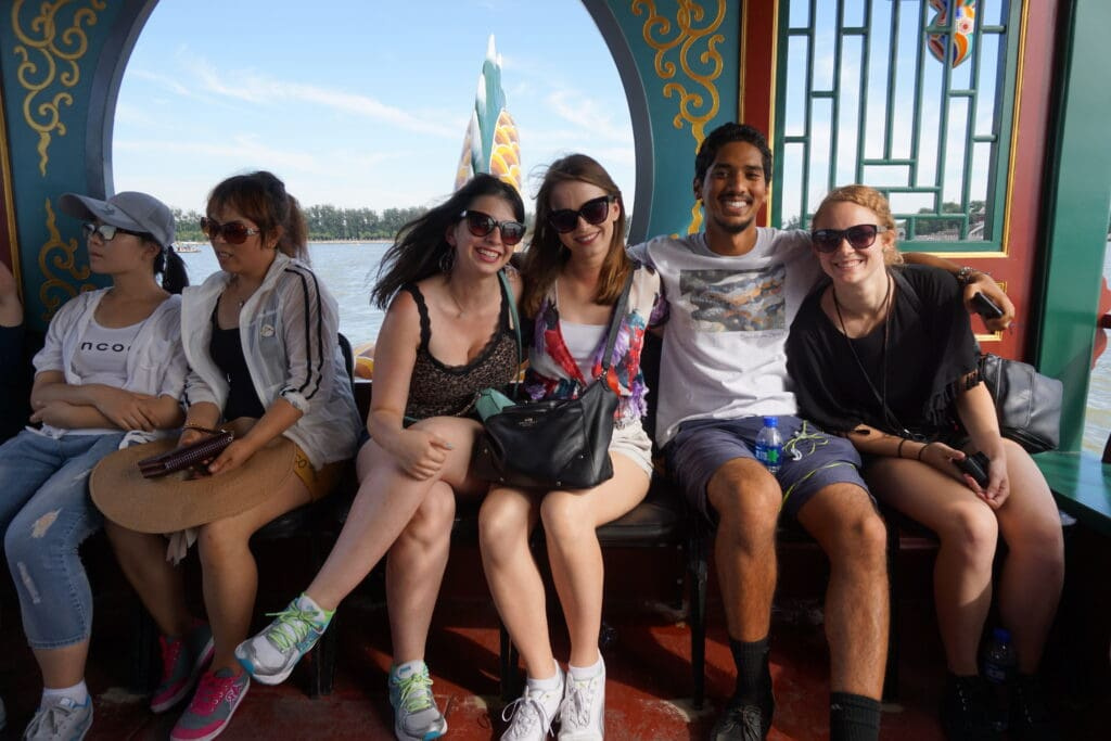 a group of people sitting on a boat